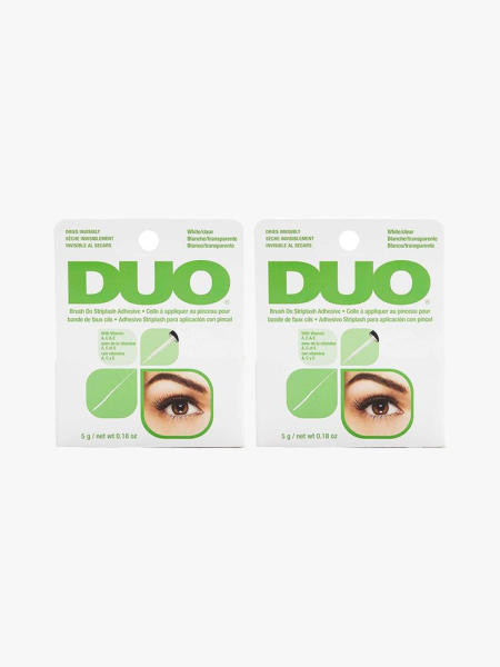 DUO Brush-On Clear Lash Glue in branded components on a light gray background